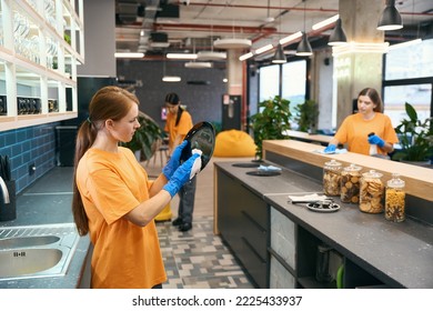 Cleaning Female Work Team Cleaning In Kitchen Area Coworking Space