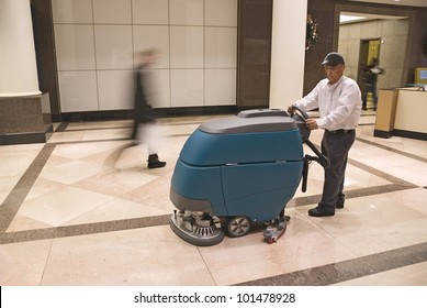 Cleaning Floor In Office Building Lobby