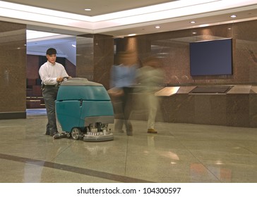 Cleaning Floor In Office Building Lobby