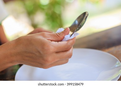 Cleaning fork every time before meals. (selective focus)