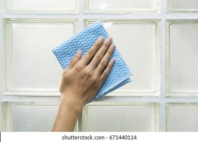 Cleaning Glass Block By Woman Hand