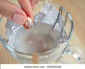 Cleaning Gold And Silver Jewelry. Cleaning Women Jewelry Concept.