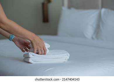cleaning hotel, bath towel on white bed, room service  - Shutterstock ID 2147404143