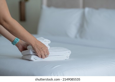 cleaning hotel, bath towel on white bed, room service  - Shutterstock ID 2149085535