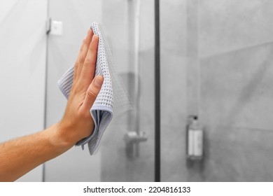 Cleaning The House, Washing The Glass Of The Shower Cabin. Girl Cleaning Her House