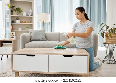 Cleaning, Hygiene And House Task With A Woman Spring Cleaning, Sanitize Living Room Furniture. Young Female Wipe And Dust, Enjoying Fresh Routine Housework In A Modern, Germ Free Living Space