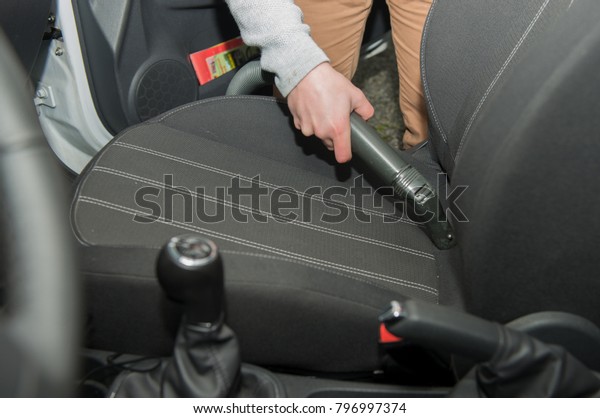 cleaning of the\
interior of the car with a\
vacuum