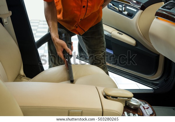 Cleaning of interior of the car with vacuum
cleaner, Car cleaning