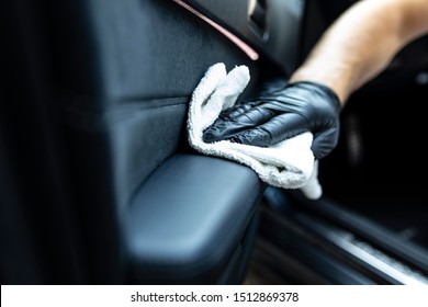 Cleaning The Interior Of The Car. Waxing Leather Upholstery In The Car Door