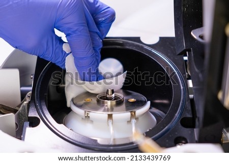 Cleaning of ion source of mass spectrometer by laboratory worker in rubber gloves. LC MS, liquid chromatography and daily routine. 