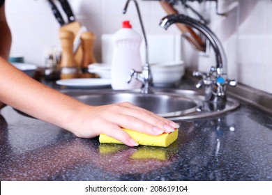 Cleaning Kitchen With Sponge