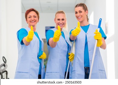 Cleaning Ladies Working In Team Showing The Thumbs Up Sign