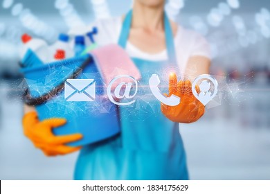 The Cleaning Lady Clicks On The Contact Icon On A Blurred Background.