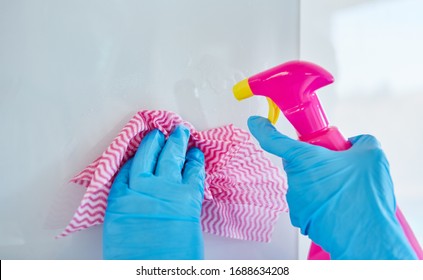 Cleaning Lady With Disposable Gloves During Cleaning And Disinfection In A Clinic During A Coronavirus Epidemic