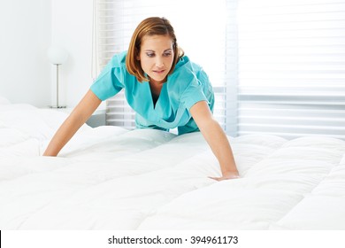 Cleaning Lady Doing Housekeeping In A Hotel Room