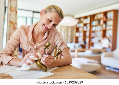 Cleaning Lady Or Domestic Help Cleaning Brass Candlesticks