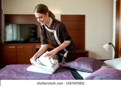 Cleaning Lady Providing A Comprehensive Service In A Hotel Room, Hotel Cleaning Staff