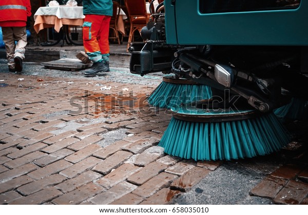 Cleaning machine\
on city street. Ecology\
concept