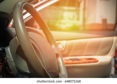 Cleaning And Maintenance Car Concept: Selective Focus On Steering Wheel. Side View Of Clean And Shinny Car Steering Wheel, Driver Seat, Interior Car, Dashboard. Beauty Interior Leather Car. 