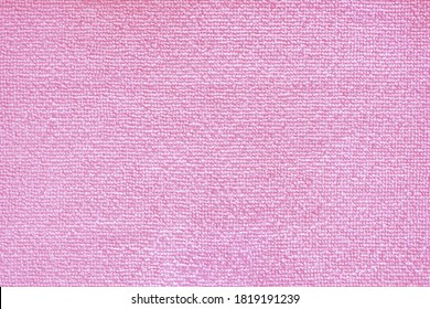 Cleaning microfiber pattern. Pink polyester microfibre texture. Synthetic fiber material Cleaning cloth for dust or kitchen top view closeup