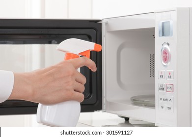 Cleaning The Microwave Oven