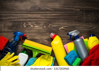 Cleaning product, household, sanitary supplies on wooden table. Top view with copy space. - Powered by Shutterstock