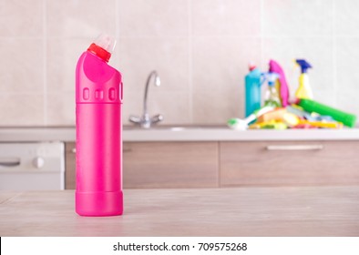 Cleaning product on table with bunch of detergents and equipment on kitchen countertop in background. Housekeeping concept - Powered by Shutterstock