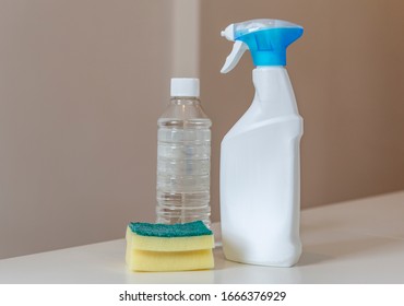 Cleaning Products: Bleach Spray, Bottle Of Disinfectant (ethanol) And Scourer