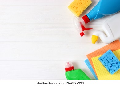 
cleaning products on a colored background top view.