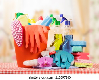 Cleaning Products On Table And Kitchen Background