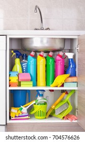 Cleaning Products Placed In Kitchen Cabinet Under Sink. Housekeeping Storage Space