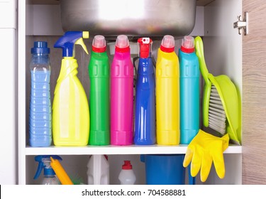 Cleaning Products Placed In Kitchen Cabinet Under Sink. Housekeeping Storage Space