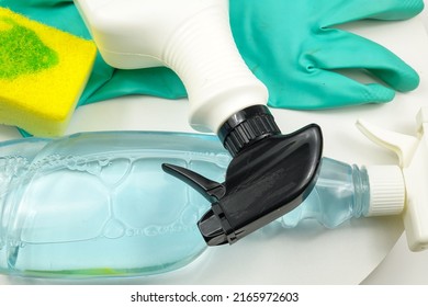 Cleaning Products: Cleaning Sponge, Brush, Cleaning Liquid In Plastic Spray Bottle, Washing Up Glove. Set Of Different Products For House Cleaning   