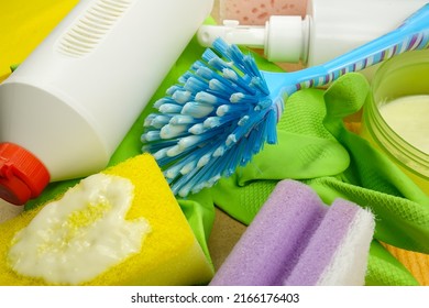 Cleaning Products: Cleaning Sponge, Brush, Cleaning Liquid In Plastic Spray Bottle, Washing Up Glove. Set Of Different Products For House Cleaning   