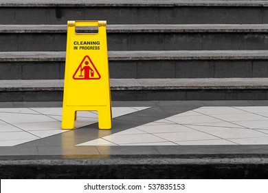 Cleaning Progress Caution Sign Put On The Ground In Front Of Building With Copy Space On Right.