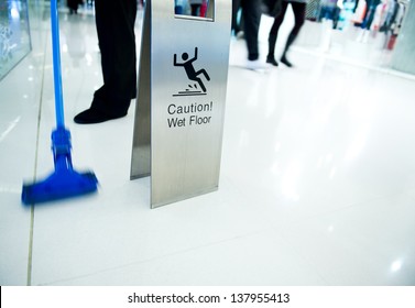 Cleaning In Progress, And Wet Floor Caution Sign Besides.