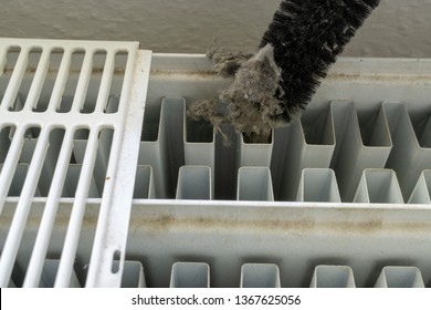 Cleaning A Radiator With A Brush