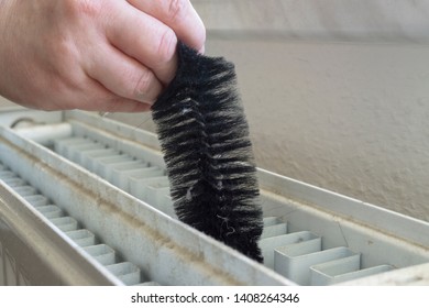 Cleaning A Radiator With A Brush