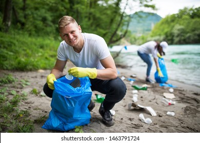 Cleaning River Beach From Garbage