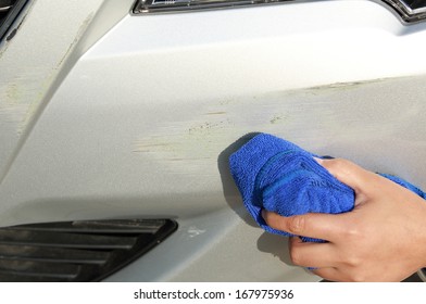 Cleaning Scratches At Front Bumper Of Fender Bender Car