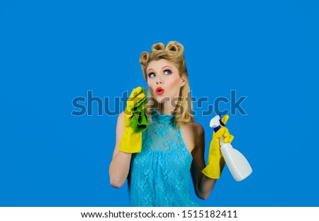 Cleaning service. Beautiful woman holds duster and spray. Cleaning tools. Happy retro housewife. Housewife ready for housework. Cleaning pin up woman. Girl cleaning with rag and bottle spray. Cleanup.