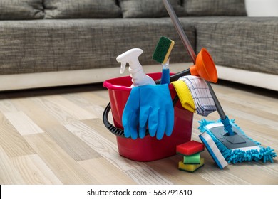 Cleaning service. Bucket with sponges, chemicals bottles and mopping stick. Rubber gloves, plunger and towel. Household equipment. - Powered by Shutterstock