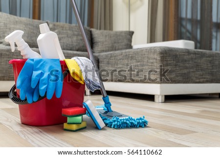 Cleaning service. Bucket with sponges, chemicals bottles and mopping stick. Rubber gloves and towel. Household equipment.