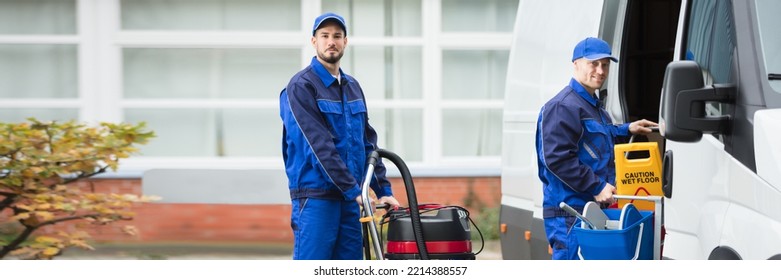 Cleaning Service Professional Worker Unloading Equipment From Van