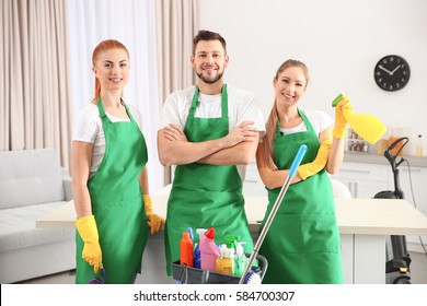 Cleaning Service Team At Work In Kitchen