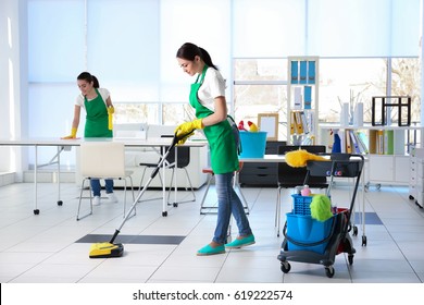 Cleaning Service Team Working In Office