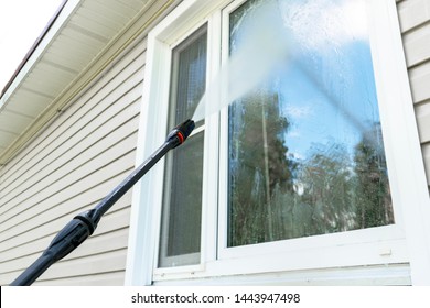 Cleaning Service Washing Building Facade And Window With Pressure Water. Cleaning Dirty Wall With High Pressure Water Jet. Power Washing The Wall. Cleaning The Facade Of The House. Before And After 