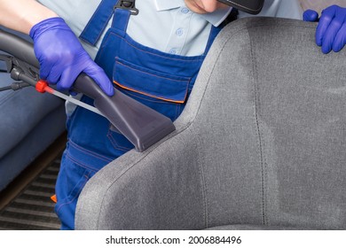 Cleaning Service Worker Cleans The Drapery Of The Office Chair