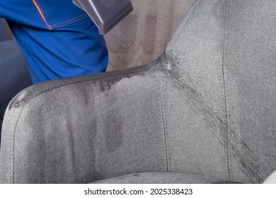 Cleaning Service Worker Cleans The Drapery Of An Office Chair, Close-up