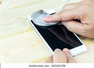 Cleaning Smart Phone Screen With Microfiber Cloth